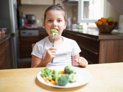 little-girl-eating-healthy-vegetables-home1586436640140111755